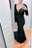 This dress is beautiful, and I feel very sexy in it. I have a 32 G bust so the top is a little awkward with the built in V as it pokes out at the bottom. It could probably be fixed with boob tape. I might try that before I return it. It is also a little long even with heels so it needs to be altered a tiny bit. I'm glad I went with a large though, Meduim would have been too snug to get into. There is no zipper on this dress. - Nicole J.