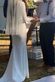 I absolutely loved this dress on my wedding day, however when I first tried it on you definitely had to trust the process with alterations. I think they purposefully make the sleeves pretty long. Also for me personally the bottom half fit great right out of the box, however the top was very big The bust, chest, arms were all way to big. However after altering the fit perfectly. This dress is also very easy to alter, if you have a basic sewing machine you can do it yourself. Also the material is very stretchy so it is forgiving. I altered the sleeves where they would be tight due to just my personal preference. I also added a jewel belt which i think added a little extra bling. I did have to get double sided tape the keep the shoulders on after alterations due slippage. Such an elegant and simple dress. Everyone thought it was a very expensive dress. - Sara R.