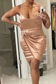 I wore this to a nude themed party & it was perfect! It's just short enough to be flirty but not too short. The straps are not adjustable (only con if I had to give one), so I'll get them altered at some point. I was able to wear it without a bra, & the material is shiny but doesn't give it a cheap look. - Chelsea P.