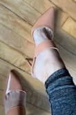 Love this style and have had my eye on it for a long time as I wanted a non-suede nude mule. The shoe fits perfectly and is not too high, but I docked a star because the color pulls more peach to me than a true nude. Not a deal-breaker as I will still keep them, but not exactly what I was hoping for either. I am usually a 6.5 or 7 in shoes, but I have been consistently 6.5 in Lulus brand so ordered as such. As somebody with wider feet, the band is not tight and the toe box is of good fit too. Hope this review helps! - Stephanie S.