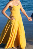 I wore this dress for my engagement photo shoot and it was absolutely beautiful! I did have to alter the top because it was a bit loose up top but if I bought a small, I think it would have been tight on my hips. I wore a 2.5 inch heel with this dress so i didn't have to hem the bottom. - Jenny K.