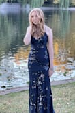 We ordered this dress last minute for my daughters Senior Year pictures. The dress was perfect for what we wanted. Simple and elegant with just enough sparkle. The back of this dress is beyond gorgeous! - Shannon B.