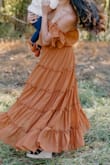 I wore this dress to my baby's first photoshoot. I got a small and it fit perfect. Super comfortable. Stayed in place. Color is as on the site. - Thresha P.
