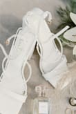 I thought these were going to be way too high, but honestly I felt so confident and beautiful walking down the aisle! These were the perfect wedding day shoes. I got so many compliments, and felt so steady all day since the heel is thick and not skinny. - Erin P.