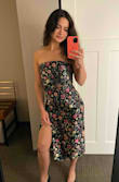 Pretty dress. I ordered a small and it was pretty baggy so I did have to get it altered. I love the pattern and slit on the side. I felt that it was flattering. However, the top part was cheaply cut and not made well at the top of the bust. - Kaitlyn M.