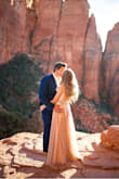 Absolutely love this dress! My husband and I were celebrating our 10 year wedding anniversary in Sedona with our two kids and we hiked up Cathedral Rock in our hiking clothes, then I changed into this dress and they in suits to do an anniversary shoot. It fit pretty well everywhere but I had the dress taken in at my shoulders a bit and hemmed at the bottom but the length that it is was also beautiful, I just didn't want to trip up there! Ha! I love the photos we got for this special occasion and the dress is just so well made! - Nicole M.