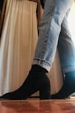 These are beautiful boots and they are the only ones I could find that had a taller shaft height with a pointed toe and under 3 in heels. If I was writing the review based on those aspects this boot is perfect! However, I expected a higher quality item.. the faux suede rubs off quite easily. I've only worn them twice and the tip of the toe is fading. Additionally, the seams were a little wonky and the shoe came with some kind of excess fabric stuck inside the toe. I chose to keep it rather than sending it to the landfill.. but the quality just kind of disappointed me because the style of these boots is absolutely perfect. also, if you're a half size I had to size up. - Charlie C.