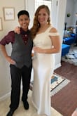 This dress was perfect for our fall wedding. It was so helpful to see it on so many others before I purchased, I wore Spanx underneath and it still fit like a glove! I have fairly broad shoulders, and was worried that this might not be flattering, so I bought a back-up dress just in case. I was pleasantly surprised at how flattering it was (especially in the glutes)! Also, I'm 5'7", and I wore a 1.5" heel, and the dress was the perfect length. I'm guessing this might not work as well for much taller ladies. If you're on the fence, go for it! - Laura O.