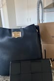 Highly recommend. Thick material. Sturdy shape. Lulus took great care to cover the bag before shipping so no scratches. I was super impressed. Arrived sooner than expected. Very very pleased. Already had someone ask where I got it. Wish strap could go a little shorter, but I'm a short person. - Sara P.