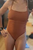 The sides gaped. I tried tape didn't work. maybe if my torso was longer? Just a weird stitch or design I guess.  Had to return even though I love how sexy it is. - Jahaira L.