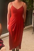 This dress fit exactly a 2. May tell my girls to size up. I ordered it to see if the color works as a bridesmaid dress. May send it back and get a medium. But I love it! Doesn't need a bra! - Hope P.