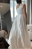 This dress is so beautiful in person. It's so elegant and is very good quality! I ended up choosing a sparkly dress but this was a CLOSE second. And it has pockets! PS. It fell off the hanger in the bag and I didn't know so please disregard the wrinkles. It has very nice pleating! - Marissa C.