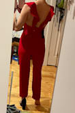 I really wanted to love this, however, the fit was a little strange on me.  This was super tight in the booty but very baggy in the front area.  The ruffle top was very pretty on, just a little big in the cups (I have a small chest so could have made that part work) the cut of the legs was great and I only would have had to hem them slightly. (I'm short so usually have to hem everything). The color is perfect for the holidays!  Sadly I ended up having to return this because of the fit in the front area. - Amanda W.