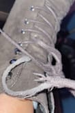 These boots look exactly as advertised, but not made of good quality, unfortunately. I've only worn these a handful of times (just to work) and they just look beat up already somehow. The shoelace on one snagged soo badly too. I'm not sure what to do. The clips on the side where the shoelaces go get "stuck" or "connected" to the other shoe and it just makes for an overall awkward bootie that I don't recommend :/ - Missy G.