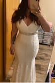 Wanted to write a review since I found them to be extremely helpful when looking for a dress. I needed to see what the dresses looked like on a busty woman. This dress was simple yet classy for a 40 something bride. Adding the belt made a huge difference. Super comfortable because it has some stretch and hugs the curves beautifully. I didn't even feel the need to change for the reception. - Erin W.