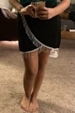 I love this skirt, it is so gorgeous! Fits perfectly. My only issue is that the tassels on the bottom layer do not go all the way around the hem, and so when I move my leg slightly you can see where the tassels cut off (pictured). I just wish the tassels either went all the way around or the skirt was tacked together at the spot so that you couldn't see where the tassels end. - Maria C.