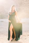 Absolutely stunning dress. Plenty of material on the bottom with a high slit that shows when walking or holding the dress aside. Fits true to size with adjustable strap lengths. The dark green is a very deep rich dark green - Michelle P.