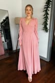 It's a beautiful dress but it's very very long. I took it to tailor to shorten and it was still too long. But love how it looks on the body. 
You just need to find something to support your breast with that amazing naked back. - Marta P.