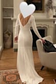 I ordered a couple dresses from Lulus after I got wedding dress fatigue at salons (where attendants are expecting you to have that "say yes to the dress" moment after trying it on for 10 seconds). I loved the experience of being able to try on dresses in the comfort of my own home and think about it for a few days. This dress ended up being The One. I had it altered to fit me perfectly and to add some detail to the sleeves. I've gotten sooo many compliments on it, and people can't believe it was under $100. The quality obviously isn't the same as a $1000 dress, but for an outfit you wear for a couple hours, you couldn't ask for a better deal. I felt and looked beautiful for my special day! - Kirsten C.