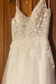 The only thing was the straps i had to adjust but it fits perfect! Its even prettier in person. The photos dont do justice! It made me change my wedding dress to this one! It fit and was comfortable! Love it!!!i got a size 4 - Ashlee M.