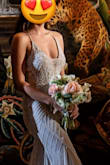 I wore this to my wedding reception and it was AMAZING! So obsessed with it. It fit perfectly and didn't even need tailoring. The dress is a tad bit heavy so it definitely dug in a bit on the shoulders after an entire night of dancing. - Deanna L.