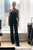 I absolutely love the fit of this jumpsuit. It's extremely comfortable and doesn't fall down in the bust area. It runs a little long. I'm 5'5" and need to wear heels with it. I also have the jumpsuit in black and may order the white one when it comes back in stock. - Jill B.