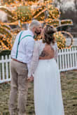 This dress was so much more than I expected and absolutely perfect for our big day!! Fit around the waist was true to size. Dress is very long and required alterations ( I expected this due to multiple other reviews reporting the same thing). The cuffs were also taken in a bit for a slimmer fit at the wrist.
I was truly nervous ordering a wedding dress online but so very glad I did. Dress does not look cheap, nice material, comfortable, and the back is absolutely my favorite part!! - Heather C.