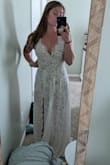 Nice quality, heavy dress. It comes with a nude liner attached (think swimsuit style). Very long if you're short but that's to be expected. - Nicole F.