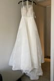 This dress is amazing. The fabric, the color, it fits my body just perfect! The tails is long but it looks flawless with the hole dress. - Alexaris M.