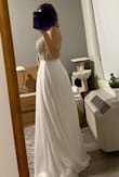Beautiful simple looking dress. It fits like a glove but it did not speak to me. I thought maybe to cut it to the knee and wear it for a legal ceremony, but I decided to return it. It's nice but I would like something else for the actual ceremony. - Olesya P.