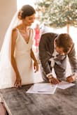 After trying on dozens of dresses, nothing could beat this simple white dress for my small summer wedding. I love the timeless style. While I wish the zipper could be removed, it's easily hidden with a veil. I got this dress altered slightly to fit tighter at the waist. A beautiful choice for the budget bride. - Camille E.