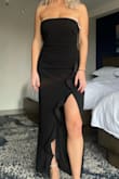 I loved this dress. I typically order a size large due to my height, but I read some reviews and decided to order down a size. This was totally the right decision. The grips on the upper portion were helpful but I feel as though I could have maybe worn a small even.. size down for an average to comfortable fit, size down potentially two for a form-fitting or "sucking" in type of feel I'd say? Overall: great dress, extremely comfortable and got so many compliments! For sure will be wearing it again in the future :) - Samantha F.