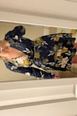 Okay, gals, I usually size up in dresses because I hate material being tight, but since this is a wrap dress I went with my true size (large) and it's perfect. On me, it is a little tight in the shoulders, but I have broad shoulders so I don't think that's the fault of the dress. My boobs are usually a huge hassle for me in dresses, but in this dress, they are very behaved. In the photos, I'm wearing a regular bra and it was pretty easy to conceal, if your jam is to go bra-less I totally think you could. I think this dress is really great for pretty much any occasion! Also, I love bell sleeves! The sleeves are a tad long on me, but not crazy. - Kayla M.
