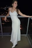 This dress SURPASSED expectations.
For sizing, read reviews! I ended up purchasing an XS (which I would normally NEVER do) but it gave me the tight fit I was looking for.  
Storytime: I had already purchased a beautiful (expensive) wedding gown and had buyer's remorse because it was more extravagant than I felt comfortable wearing and was worried about getting it dirty during dinner or dancing afterward- I purchased this dress as my "courthouse dress" and expected that it would be my "second gown"  on the wedding night. I bought it for about $75 during the Black Friday sale, which was an incredible deal for a budget bride. The dress arrived QUICKLY - extremely important since I ordered it the month before! 
I would highly recommend this dress to anyone - the button detailing on the back is beautiful, the small lace at the chest is subtle but sweet, and the low back plus a STRUCTURED fit made me feel like a star. I wore spanks and a sticky bra and I felt so good in it, even after drinking all day. GET THIS!! - Kristi K.