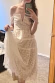 I ordered the smallest size available (XS) but still needed a lot of tailoring to get this to a point where it would fit/stay up (and we couldn't tailor it down perfectly due to the metal V in the neckline). Also, the lace will need to be ironed smooth or it will wrinkle to the point where it ends higher than the inner lining. It is not very easy to steam/iron. 

The tailor pointed out that because of the metal V in the front, this style by nature will slip and fall down more often. It also is hard to tailor down as the metal V will poke out in a weird way when the other fabric is tightened. After tailoring it as far down as we really could it was still a smidge too loose and the metal pokes out somewhat weirdly. I also had subtle bra pads sewed in.

(I'm a 30B but Lulus website only lets me enter 32A). - Sara M.