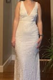 I would definitely order a smaller size than usual, I usually order a medium but the small fit perfectly. The deep v wasn't as revealing as I had expected. Very nice details but a little too sparkly for me. - Lydia C.