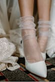 This heel is clean and modern. Its the perfect bridal shoe, and love that its so affordable! I personally styled with some tulle socks to give it an even more luxe look. - Ashlyn P.