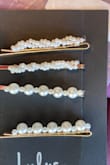 This is a pretty hairpin set. It's delicate and cute. The downside is the way the pearls are attached to the pin which makes them look cheap. - Natalia G.