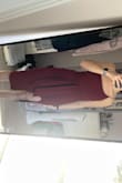 This dress fits like a glove. Very flattering and still appropriate. The tie in the front is nice because it hides the belly. Wearing this to a wedding at the end of the month. - Paige G.