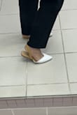 I have been looking for pointy shoes to wear at work and this is great! Be mindful that it is a bit "floppy" (see picture), so it makes a bit of flip-flop noise as you walk. Doesn't bother me. They fit great and are very comfortable! The straps are super tight, so they might come down slowly as you walk. Again, doesn't bother me either because they still stay in place. - Mariana T.