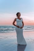 This dress elevated my look for my maternity shoot. I ordered a size small. In this photo, I'm 6 months pregnant and it was so flattering to my bump! Can't wait to wear it after! - Trish A.