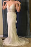 True to size, helped me determine what size I was with the size measurements. Allowed me to pick my "problem" areas and describe what my stomach, hips, and bust were like to help determine the best fitting. Overall had me sized for a 6 and that is what I ordered. Perfect!!! When ordering online, I'm always afraid of the quality of the material and this by far exceeded my expectations. Very glamorous with great details. Will need to be hemmed, but that is to be expected. The ties in the back allow you to fit the bust in your own way. Stings are very durable, thick, and silky. Very happy with the price and the quality! I can't wait until my big day! - Anjel K.