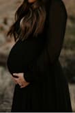 I loved this dress and got a ton of compliments. I am 31 weeks pregnant and it worked beautifully for our maternity photos. Might run a little large if you aren't carrying a babe around BUT wanted to share in case other mamas to be are looking for pregnancy-friendly styles! - Macie M.