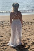 Considering I planned my wedding in 2 weeks and one of them was during an insane winter storm where we had no power for 10 days. It was lost in my town for 5 days before showing up 2 days before leaving for Hawaii! 
I put it on and it fit like a glove!! It is so beautiful! Great quality!! I didn't want to take it off!! My husband was jaw dropped! It was everything I have wanted!! The slit is high and sexy! The bodysuit is thick and comfortable! The thin straps scared me to get into by myself but they're strong and secure!
I couldn't be any happier! I'll probably wear it again when we have the party with everyone!! - Carlymae P.