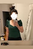 This runs small but it's flattering and the fabric is nice and thick in a good way. Kind of like a thinner taffeta. Beautiful color, has a side zip which is nice and keeps you sucked in. I would say it's probably not ideal for anyone with a large chest, as it'll smush your boobs. It does that for me and I'm only a B. Would love this in black. - Jessica B.