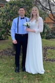 I wore this dress as my wedding dress. It is so beautiful and has such a classic look to it. The open back is stunning. The material is very high quality, nothing "cheap" about it. It does run large. I ordered a large and it was way too big. It was even too long which is rare for me, as I'm 5'10 (180 lbs.) I had it altered to fit me. The arms were long enough but I thought they were an awkward length on me, so I had them tightened and shortened a bit. I think I could have gotten away with a medium. I'm so in love with this dress, and couldn't picture myself eloping in anything else! - Shelby M.