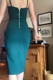 This dress is so flattering! It fits like an actual glove but is still stretchy enough to be comfortable. The slit isn't too high and the neckline is modest enough. The fabric is so soft and thick so you don't even really need a bra. - Erin M.