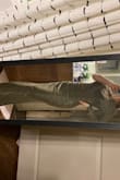 I usually am a size small, but I took a risk and ordered an XS. I am so glad I did. Not to my surprise, it was too long. I am (4'11") and will have to get a large amount taken off the bottom. It would fit someone who is 5'9" perfectly. The bust was a perfect size. I have to keep good posture or it will look as if the neckline sags. I love this dress and am very pleased with the size I ordered. The material is very thick. The slit comes to an appropriate length and doesn't show too much leg. It would be very easy to get the slit adjusted if needed. - Bailey F.