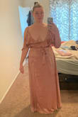 This is a well made and beautiful dress. I am returning this dress because there is not enough coverage through the chest. I am "apple" shaped. The dress fit around my middle; the side seams lined up with the middle of my body. However, it felt way too small around the top. The dress comes with a snap closure the bust region. I am not sure who on earth would be able to use that snap. It is clear that even the model in the photos is not using the snap closure at the bust. If you have a medium or larger chest/bust, you might be able to relocate the snap or sew-tack the chest, or have to be comfortable with a very revealing neckline. Also, the length was floor length when I was NOT wearing heels. Keep this in mind taller folks. - Adriana C.