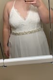 I wanted to buy a cheap wedding dress that would get the job done and make me feel pretty. This dress is great!!! I'm having alterations done as even with my wedding shoes it's a little long for me. I don't love the adjustable straps just because they can be unreliable, so I am also having the straps made stationary, but this dress is great!! - Emily M.